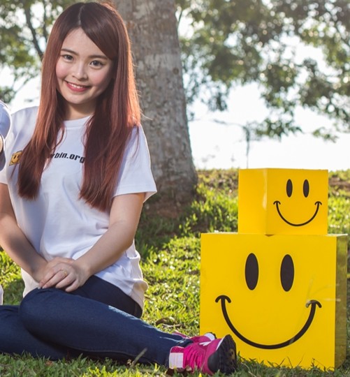 Volunteer with Yellow Bin boxes